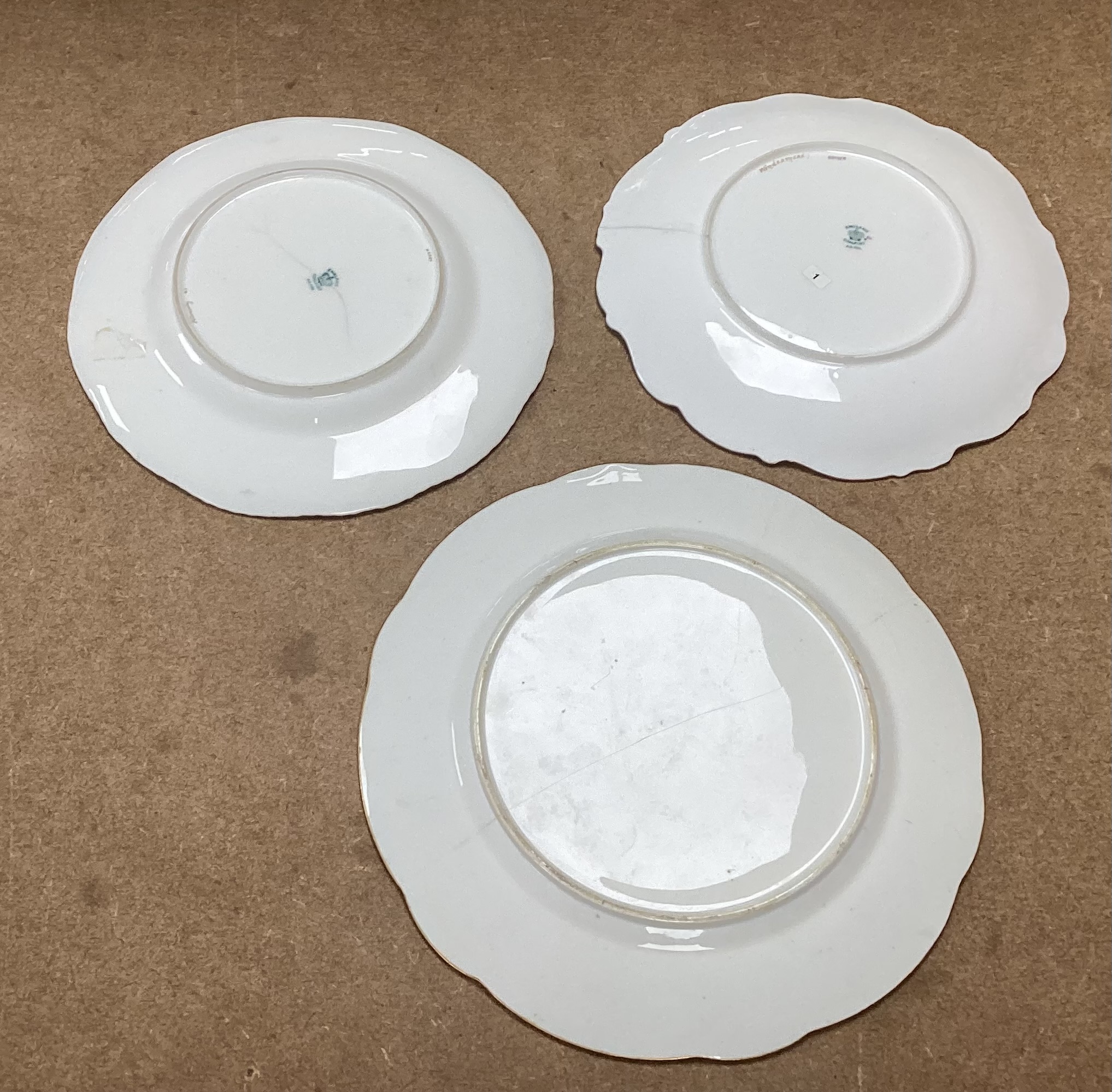 Four 19th century Coalport plates, a Coalport dish, a Minton plate, a Coalport inkstand in Chelsea style and a Derby cache pot, ink stand 40cms wide
